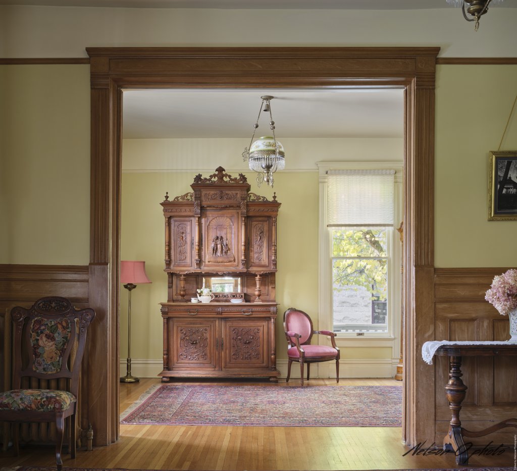 Formal dining room with an antique carved hutch